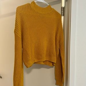 cropped knitted yellow turtleneck sweater